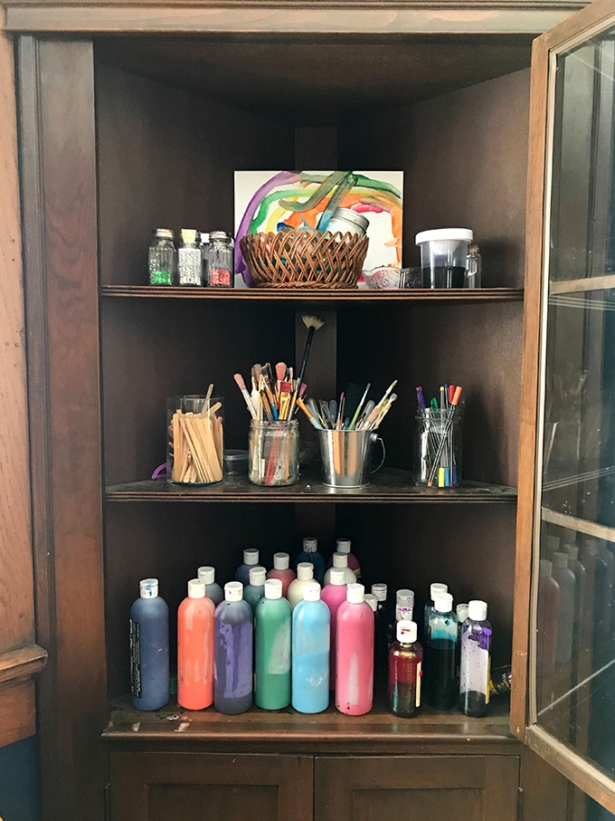 Art supplies in corner cabinet