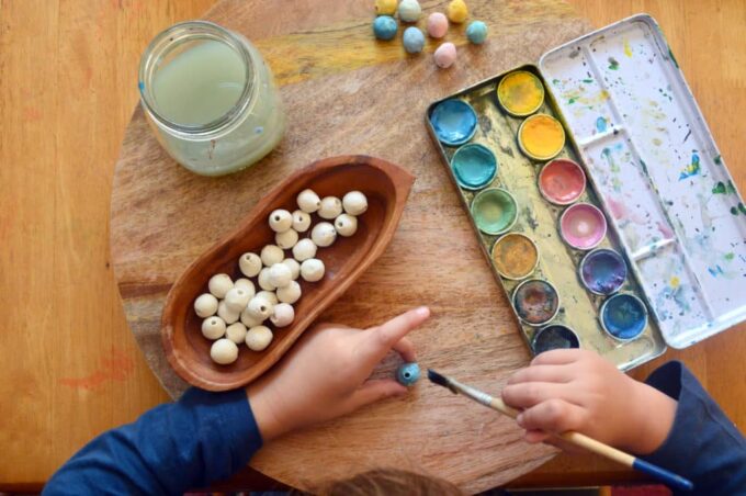 Child-painting-clay-beads-for-nature-mobile2